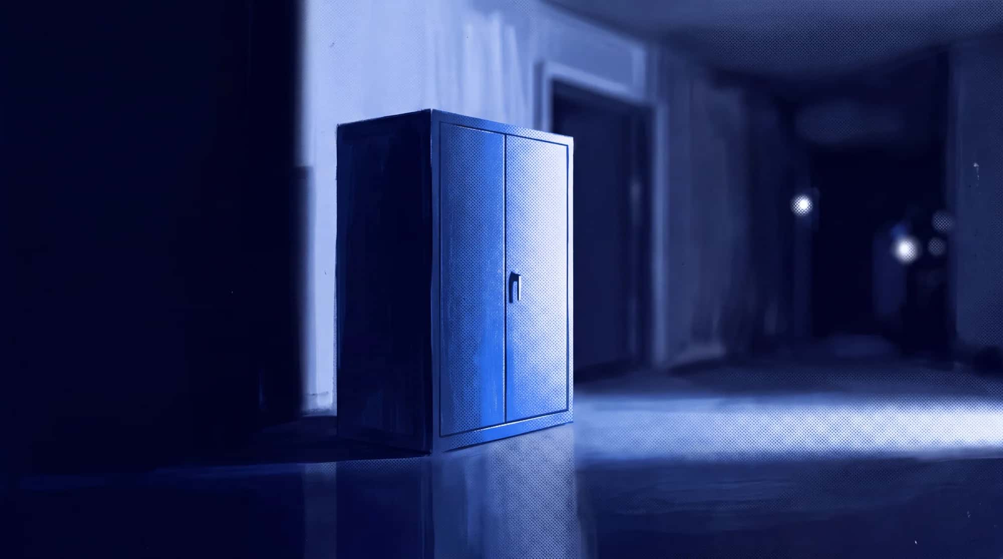 A steel cabinet standing closed in an empty room at night, one light raking across it